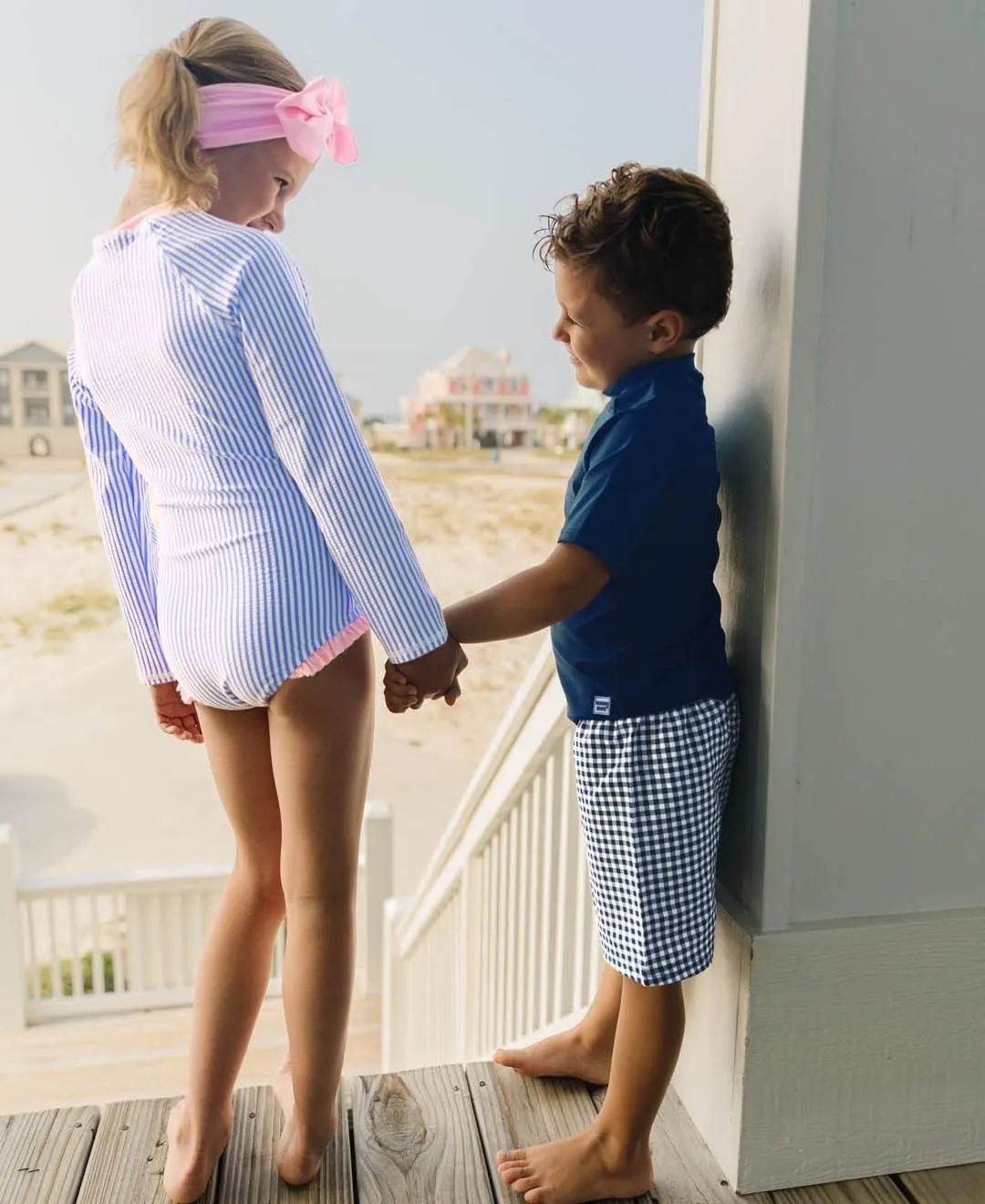 RuffleButts® Girls One Piece Rash Guard Baby Swimsuit UPF 50  Sun Protection